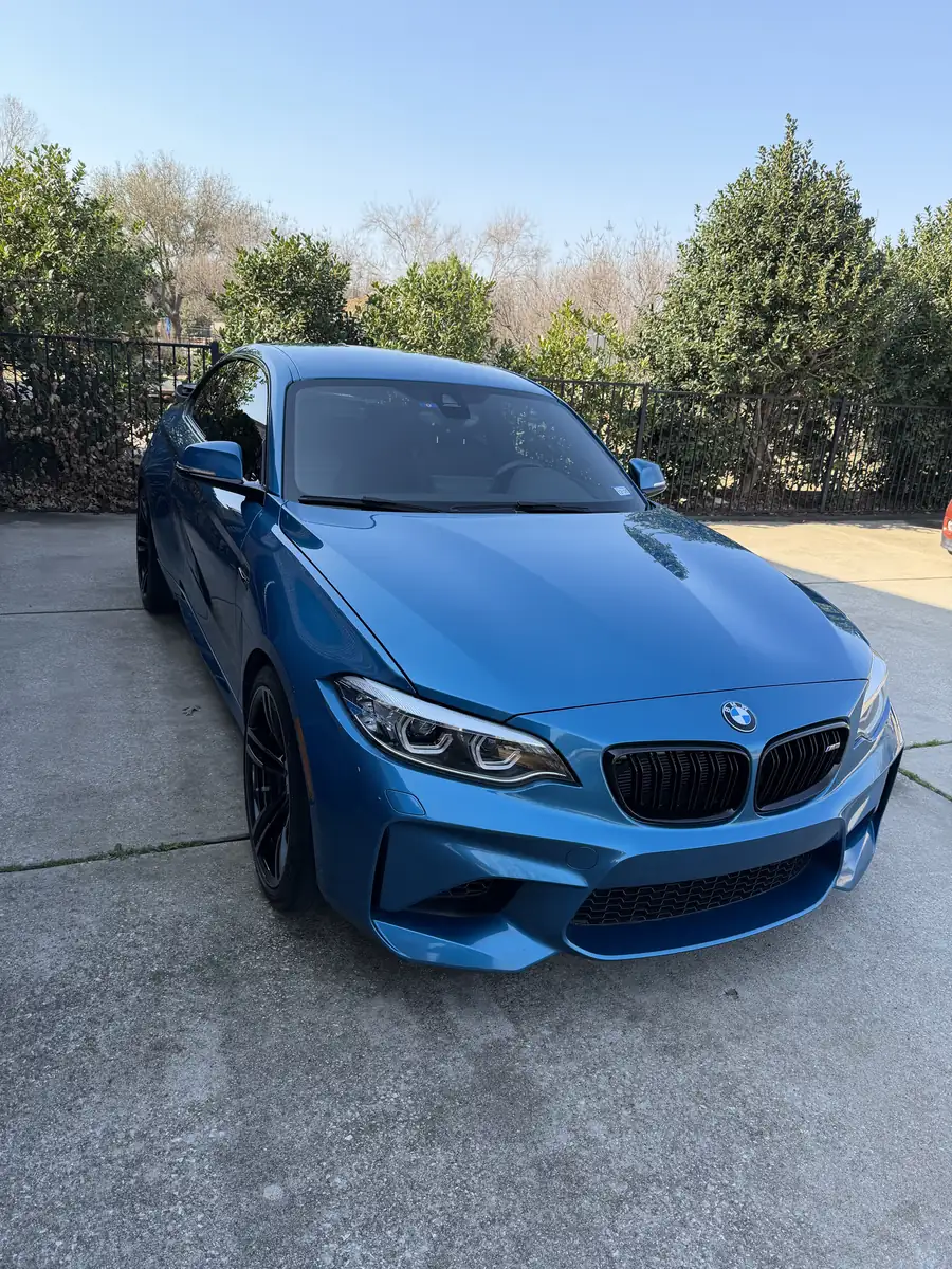 Blue BMW coupe, front three-quarter view