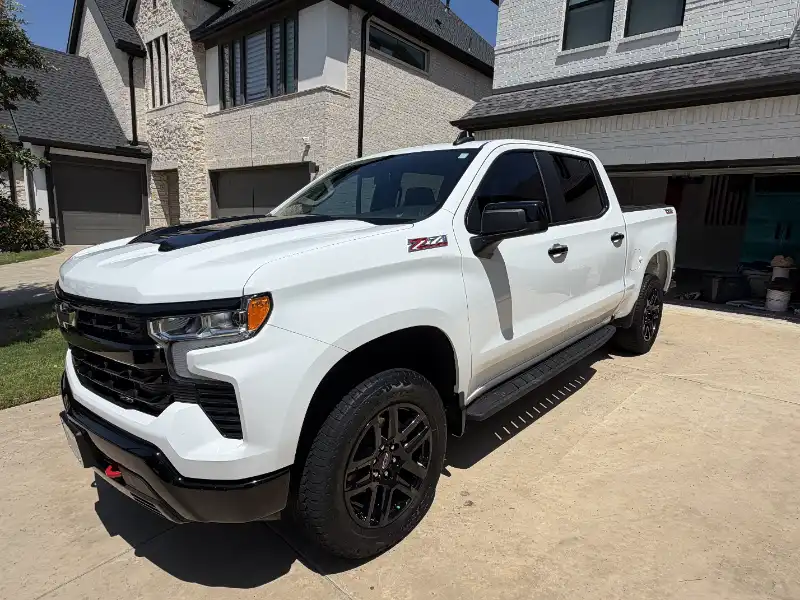 White Chevy pickup on a driveway