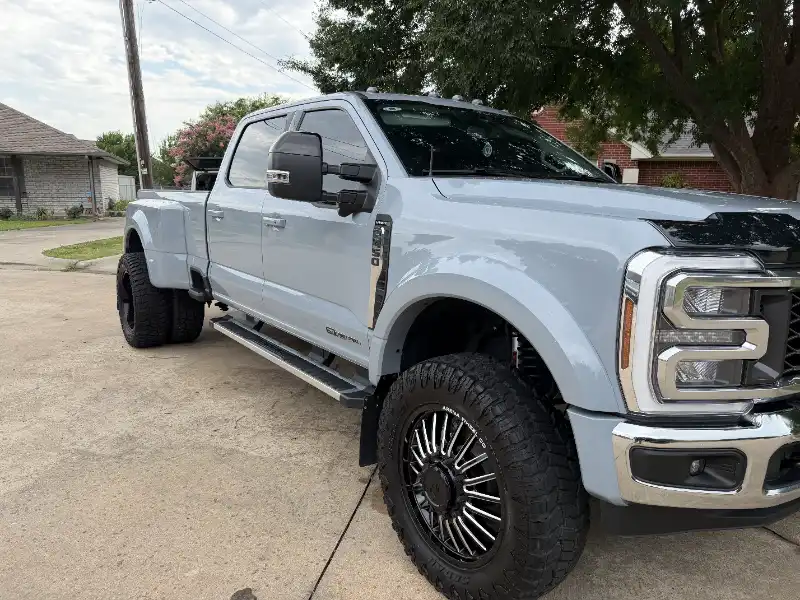 Silver Ford pickup on a driveway