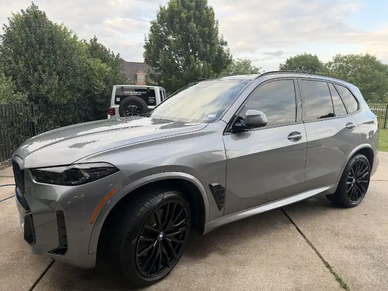 Gray BMW SUV on a driveway